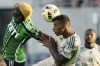 Austin FC forward Gyasi Zardes, left, and Portland Timbers defender Miguel Araujo, right, vie for control of the ball during the first half of an MLS soccer match in Austin, Texas, Wednesday, May 29, 2024. (AP Photo/Eric Gay)