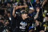 Fans cheer and throw water during the first half of an MLS soccer match between Los Angeles FC and Minnesota United, Wednesday, May 29, 2024, in Los Angeles. (AP Photo/Ryan Sun)