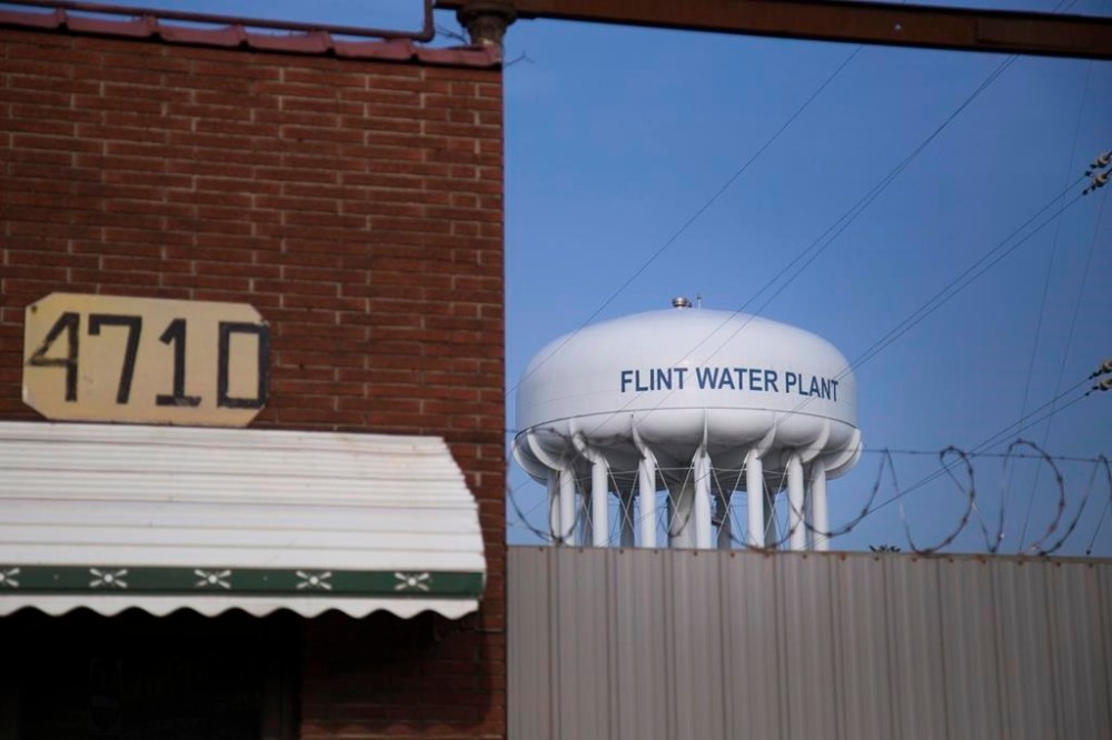 FILE - The sun sets on the Flint Water Plant on the northeast side of Flint, Mich., June 14, 2017. The state of Michigan said it's willing to step in and oversee property repairs at 1,900 homes in Flint where water pipes have been inspected or replaced but the grounds remain a mess. In March 2024, the city was found in civil contempt by a judge after blowing past deadlines to get the work done, years after a water switch in Flint in 2014 caused lead to leach off old pipes, spoiling the drinking water system. (Shannon Millard/The Flint Journal via AP, File)