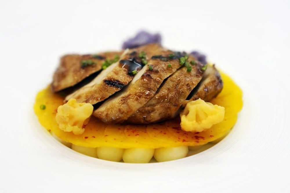 FILE - A serving of Good Meat's cultivated chicken is shown at the Eat Just office in Alameda, Calif., June 14, 2023. The U.S. approved the sale of lab-grown meat for the first time in June, 2023, allowing Good Meat and another California startup, Upside Foods, to sell cultivated chicken. (AP Photo/Jeff Chiu, File)