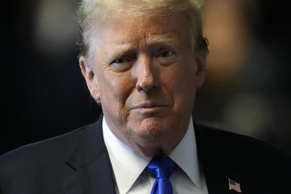 Former President Donald Trump speaks to members of the media at Manhattan Criminal Court, Thursday, May 30, 2024, in New York. Jury deliberations in Trump's criminal hush money trial enter a second day as jurors navigate the weighty task of evaluating the former president's guilt and innocence alongside the facts of the case. (AP Photo/Seth Wenig, Pool)