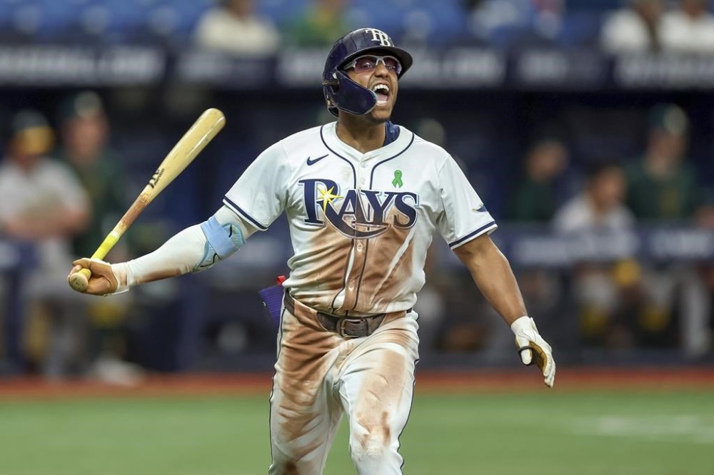 Tampa Bay Rays' Richie Palacios celebrates his game-winning RBI single in the 12th inning of a baseball game against the Oakland Athletics, Thursday, May 30, 2024, in St. Petersburg, Fla. The Rays won 6-5 in 12 innings. (AP Photo/Mike Carlson)