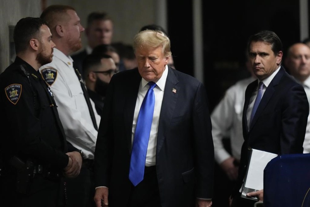 Former President Donald Trump walks to make comments to members of the media after being found guilty on 34 felony counts of falsifying business records in the first degree at Manhattan Criminal Court, Thursday, May 30, 2024, in New York. (AP Photo/Seth Wenig, Pool)