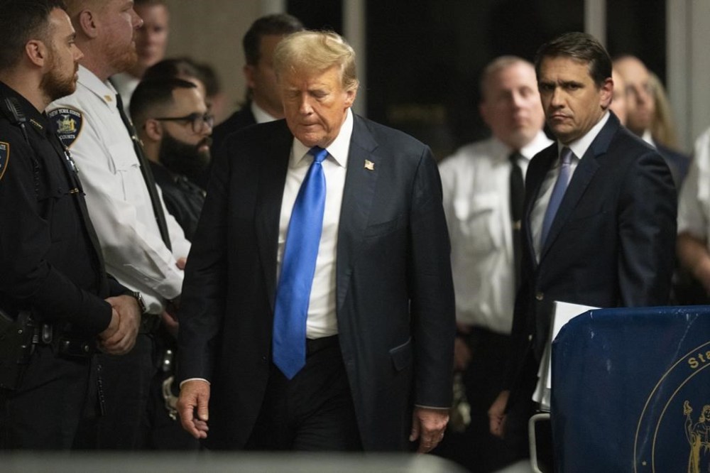 Former President Donald Trump walks outside of Manhattan Criminal Court in New York, Thursday, May 30, 2024. (Steven Hirsch/New York Post via AP, Pool)