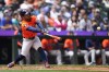 Houston Astros' Jose Altuve hits a single during the fifth inning of a baseball game against the Seattle Mariners, Thursday, May 30, 2024, in Seattle. (AP Photo/Lindsey Wasson)