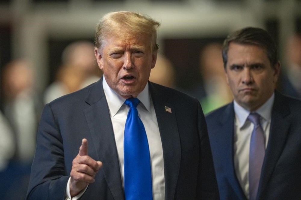 Former President Donald Trump speaks outside the courtroom after a jury convicted him of felony crimes for falsifying business records in a scheme to illegally influence the 2016 election, at Manhattan Criminal Court in New York, Thursday, May 30, 2024. (Steven Hirsch/New York Post via AP, Pool)