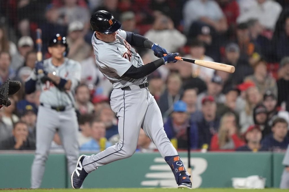 Detroit Tigers' Mark Canha hits an RBI single against the Boston Red Sox during the sixth inning of the team's baseball game against the Boston Red Sox, Thursday, May 30, 2024, in Boston. (AP Photo/Steven Senne)