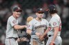 Washington Nationals outfielder Jacob Young (30), Lane Thomas (28) and Kyle Finnegan (67) celebrate a win against Atlanta Braves, in the first inning of a baseball game against the Thursday, May 30, 2024, in Atlanta. (AP Photo/Brynn Anderson)