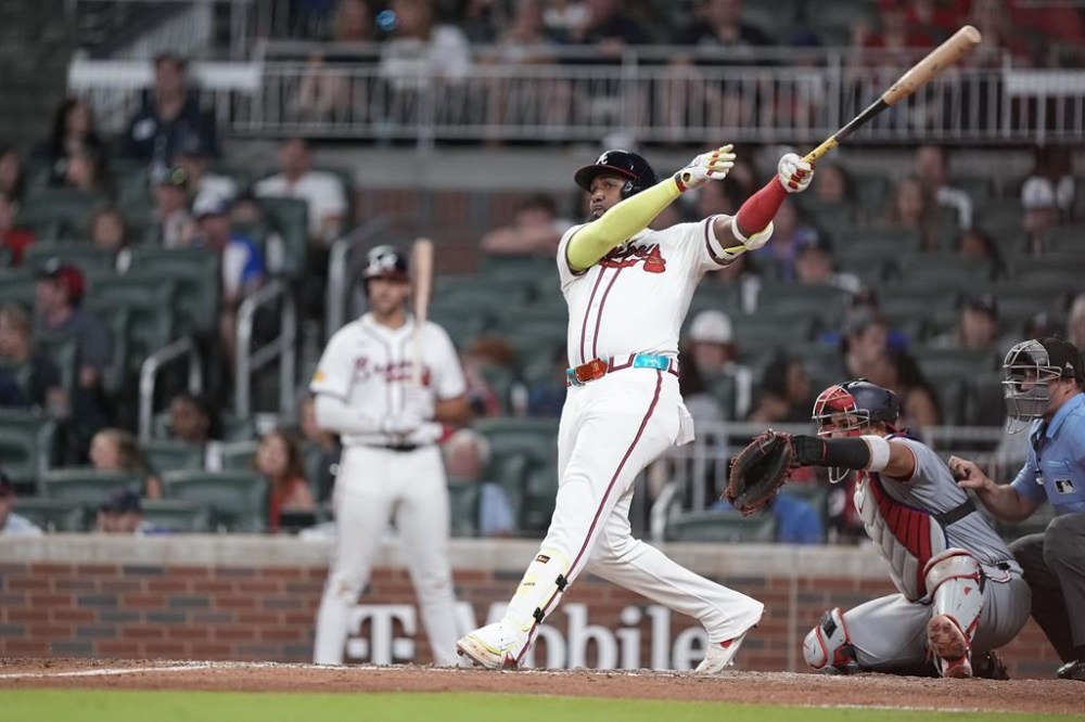 Atlanta Braves designated hitter Marcell Ozuna (20) hits a double in the ninth inning of a baseball game against the Washington Nationals, Thursday, May 30, 2024, in Atlanta. (AP Photo/Brynn Anderson)