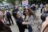 People react to the guilty verdict announced against former President Donald Trump outside Manhattan Criminal Court, Thursday, May 30, 2024, in New York. (AP Photo/Julia Nikhinson)