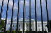 The White House in Washington is seen past the security fence on Thursday, May 30, 2024. Former President Donald Trump became the first former president to be convicted of felony crimes as a New York jury found him guilty of 34 felony counts of falsifying business records in a scheme to illegally influence the 2016 election through hush money payments to a porn actor who said the two had sex. (AP Photo/Pablo Martinez Monsivais)