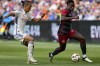 Toronto FC's Richie Laryea, right, controls the ball against FC Cincinnati forward Yuya Kubo during an MLS soccer match Sunday, Feb. 25, 2024, in Cincinnati. Laryea is expected to return from injury for Saturday's game at D.C. United. THE CANADIAN PRESS/AP/Jeff Dean