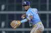 FILE - Tampa Bay Rays shortstop Wander Franco fields a ground ball out from Houston Astros' Mauricio Dubon during the ninth inning of a baseball game, Sunday, July 30, 2023, in Houston. Franco's administrative leave was extended through July 14 by Major League Baseball and the players' association. Tampa Bay's All-Star shortstop has not played since Aug. 12 while MLB continues its investigation into an alleged relationship with a minor. (AP Photo/Kevin M. Cox, File)