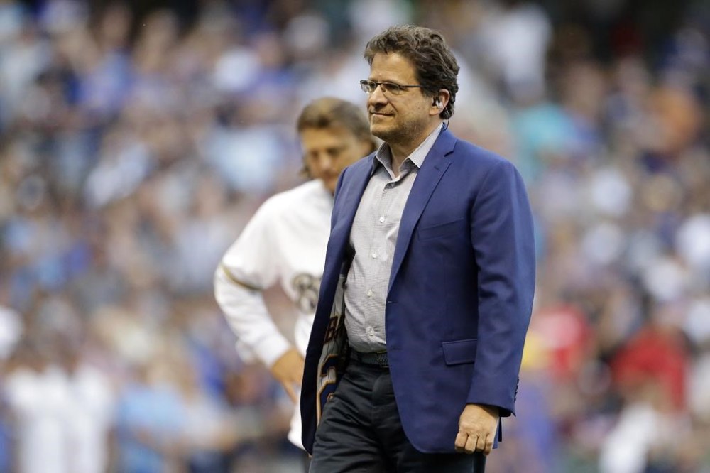 FILE - Milwaukee Brewers principal owner Mark Attanasio walks off the field after a ceremony before the team's baseball game against the Texas Rangers on Aug. 9, 2019, in Milwaukee. Attanasio acknowledged it’s too soon in the season to celebrate but still offered plenty of praise Friday, May 31, for the way new manager Pat Murphy navigated the first two months of the season while dealing with numerous key injuries. (AP Photo/Aaron Gash, File)
