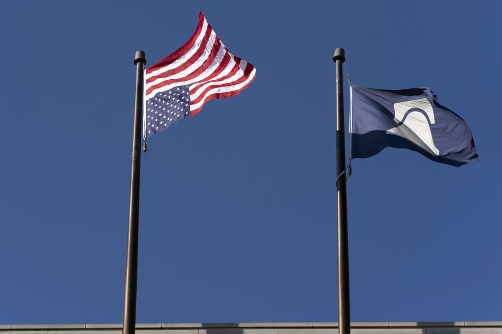 An American flag is seen upside down at the conservative Heritage Foundation in Washington, Friday, May 31, 2024. (AP Photo/Jose Luis Magana)