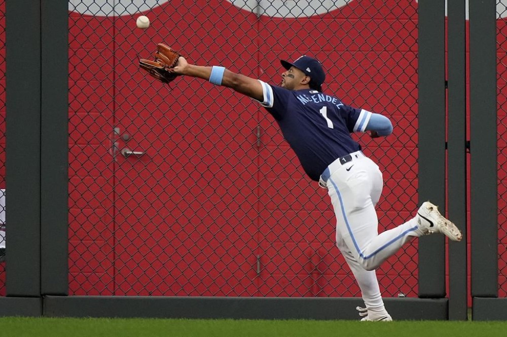Kansas City Royals left fielder MJ Melendez catches a fly ball for the out on San Diego Padres' Jackson Merrill during the second inning of a baseball game Friday, May 31, 2024, in Kansas City, Mo. (AP Photo/Charlie Riedel)
