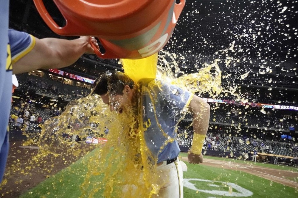 Milwaukee Brewers' Christian Yelich is douced after a baseball game against the Chicago White Sox Friday, May 31, 2024, in Milwaukee. The Brewers won 12-5. (AP Photo/Morry Gash)