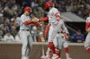 Los Angeles Angels' Jo Adell (7) celebrates with Logan O'Hoppe after hitting a grand slam off Seattle Mariners pitcher Tayler Saucedo during the seventh inning of a baseball game Friday, May 31, 2024, in Seattle. (AP Photo/John Froschauer)