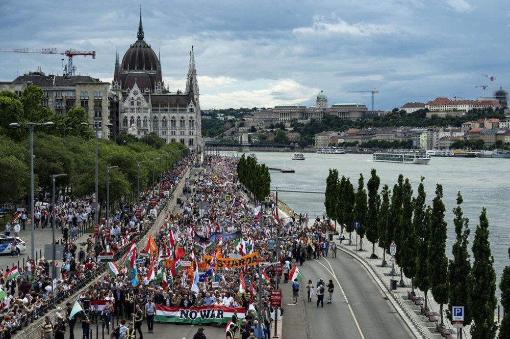 People march during a rally in support of Hungary's Prime Minister Viktor Orbán and his party in Budapest, Hungary on Saturday, June 1, 2024. Orbán, whose 14 years in power make him the European Union's longest serving leader, has focused his campaign for the June 9 European Parliament elections on the war in Ukraine, portraying his domestic and international opponents as warmongers who seek to involve Hungary directly in the conflict. (AP Photo/Denes Erdos)
