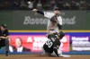 Milwaukee Brewers' Brice Turang, top right, throws to first base to turn a double play after tagging out Chicago White Sox's Lenyn Sosa (50) at second base during the ninth inning of a baseball game Saturday, June 1, 2024, in Milwaukee. (AP Photo/Aaron Gash)