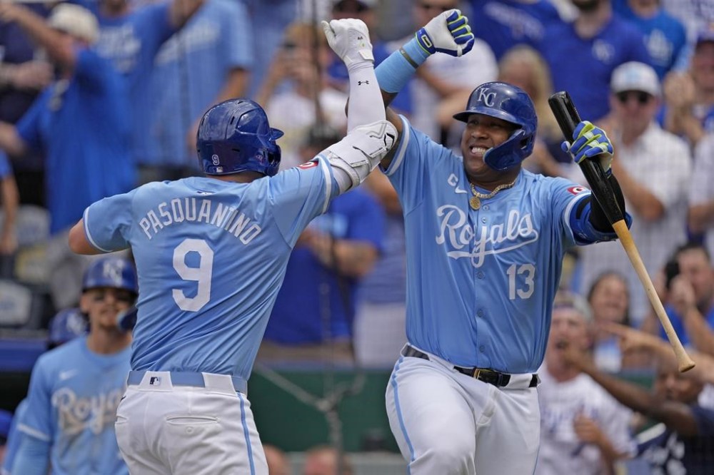 Kansas City Royals' Vinnie Pasquantino (9) celebrates with Salvador Perez (13) after hitting a two-run home run during the first inning of a baseball game against the San Diego Padres Saturday, June 1, 2024, in Kansas City, Mo. (AP Photo/Charlie Riedel)