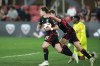 DC United midfielder Theodore Ku-DiPietro, left, runs with the ball after his goal against Toronto FC during the second half of an MLS soccer game at Audi Field, Saturday, June 1, 2024, in Washington. (AP Photo/Jose Luis Magana)