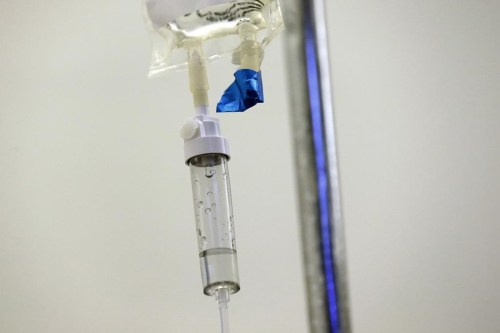 FILE - In this May 25, 2017 file photo, chemotherapy drugs are administered to a patient at a hospital in Chapel Hill, N.C. Scaling back treatment in some cancers — ovarian, esophageal and Hodgkin lymphoma — can make life easier for patients without compromising outcomes, doctors reported at the American Society of Clinical Oncology annual meeting in early June 2024. (AP Photo/Gerry Broome, File)