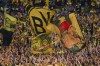 Dortmund fans cheer for their team during the Champions League final soccer match between Borussia Dortmund and Real Madrid at Wembley stadium in London, Saturday, June 1, 2024. (AP Photo/Ian Walton)