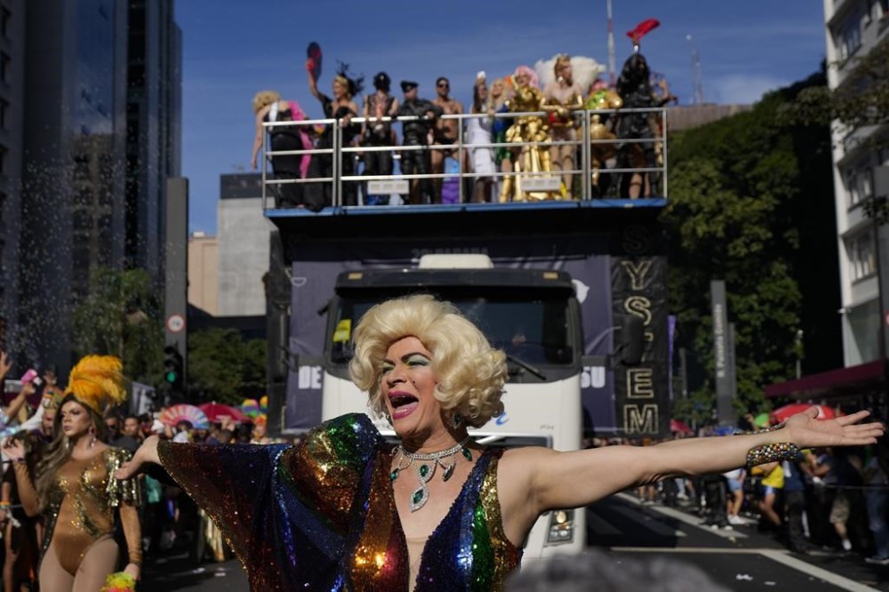 A reveler dances during the annual Gay Pride Parade in Sao Paulo, Sunday, June 2, 2024. (AP Photo/Andre Penner)
