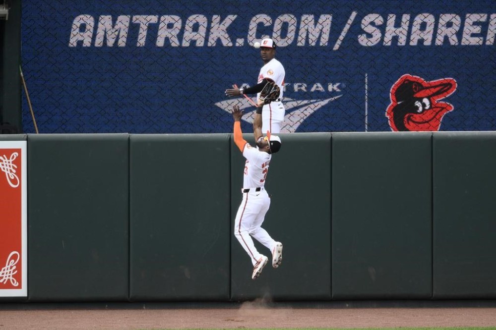 Baltimore Orioles center fielder Cedric Mullins leaps up to make a catch on a fly ball by Tampa Bay Rays' Jonny DeLuca during the fifth inning of a baseball game, Sunday, June 2, 2024, in Baltimore. (AP Photo/Nick Wass)