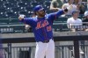 New York Mets' J.D. Martinez celebrates after his RBI triple during the third inning of a baseball game against the Arizona Diamondbacks at Citi Field, Sunday, June 2, 2024, in New York. (AP Photo/Seth Wenig)
