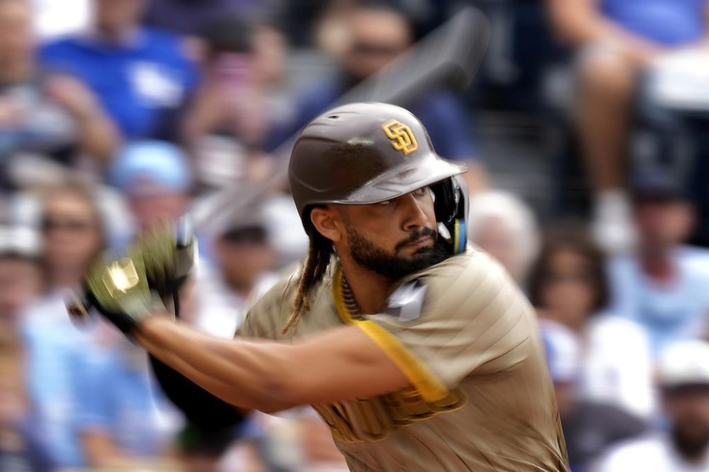 San Diego Padres' Fernando Tatis Jr. bats during the first inning of a baseball game against the Kansas City Royals Sunday, June 2, 2024, in Kansas City, Mo. (AP Photo/Charlie Riedel)
