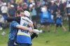 Scotland's Robert MacIntyre celebrates with his father, Dougie MacIntyre, after winning the Canadian Open golf tournament in Hamilton on Sunday June 2, 2024. THE CANADIAN PRESS/Nathan Denette