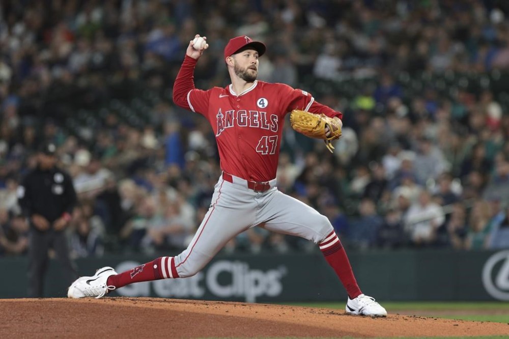 Los Angeles Angels starting pitcher Griffin Canning throws during the first inning of a baseball game against the Seattle Mariners, Sunday, June 2, 2024, in Seattle. (AP Photo/Jason Redmond)