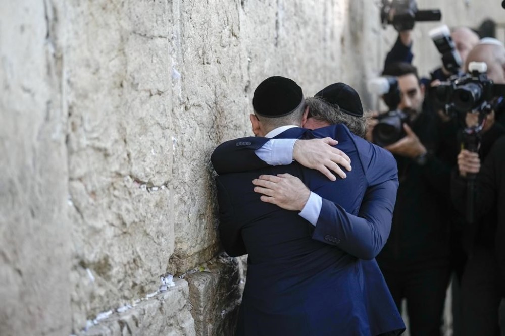 FILE - Argentine President Javier Milei and Rabbi Shimon Axel Wahnish embrace at the Western Wall in Jerusalem's Old City, Feb. 6, 2024. Although born and raised Roman Catholic, Milei has increasingly shown public interest in Judaism. (AP Photo/Leo Correa, File)