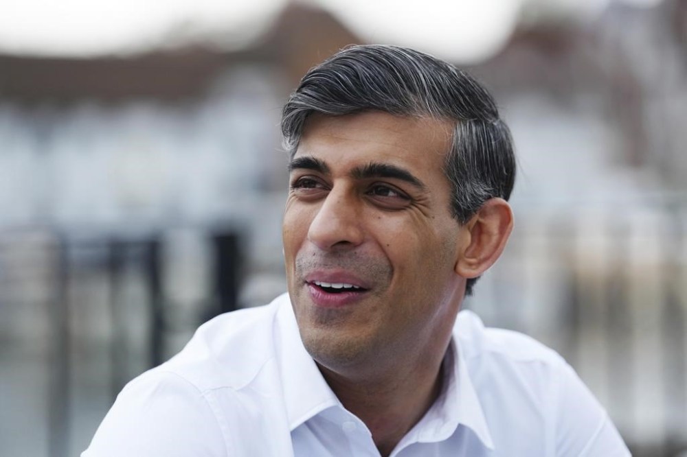Britain's Prime Minister Rishi Sunak visits Leander Rowing Club as he campaigns in Henley-on-Thames, England, Monday June 3, 2024. Since announcing that the UK General Election will be held on July 4th, Rishi Sunak has visited key battleground regions across the UK. (Carl Court/Pool Photo via AP)