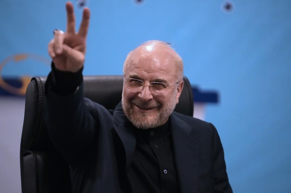 Iran's hard-line parliament speaker, Mohammad Bagher Qalibaf flashes a victory sign while registering his name as candidate for the June 28 presidential election at the Interior Ministry, in Tehran, Iran, Monday, June 3, 2024. Monday marked the last day of registration for the competition. Other politicians have been rumored as potential candidates in the vote to replace Ebrahim Raisi, who died in a helicopter crash with seven others on May 19. (AP Photo/Vahid Salemi)