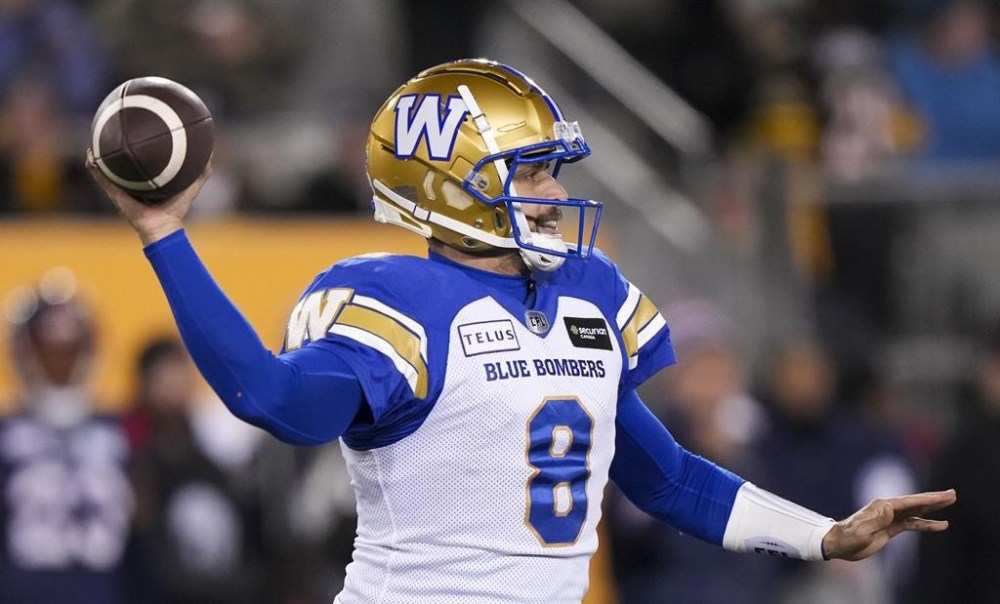 Winnipeg Blue Bombers quarterback Zach Collaros (8) throws the ball against the Montreal Alouettes during the first half of football action at the 110th CFL Grey Cup in Hamilton, Ont., on Sunday, November 19, 2023. THE CANADIAN PRESS/Nathan Denette