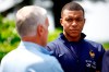 French soccer player Kylian Mbappe, right, listening to head coach Didier Deschamps at the national soccer team training center in Clairefontaine, west of Paris, Monday, June 3, 2024 ahead of the UEFA Euro 2024. (Sarah Meyssonnier/Pool Photo via AP)