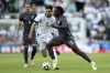 England's Eberechi Eze, right, tries to drive the ball past Bosnia and Herzegovina's Armin Gigovic during an international friendly soccer match between England and Bosnia and Herzegovina at St. James Park in Newcastle, England, Monday, June 3, 2024. (AP Photo/Scott Heppell)