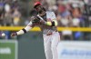 Cincinnati Reds shortstop Elly De La Cruz throws to first base to put out Colorado Rockies' Elias Díaz in the fifth inning of a baseball game Monday, June 3, 2024, in Denver. (AP Photo/David Zalubowski)