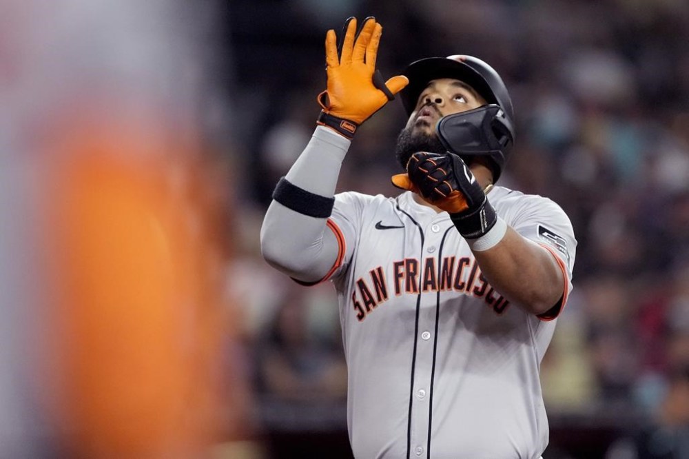 San Francisco Giants' Heliot Ramos celebrates his solo home run against the Arizona Diamondbacks during the seventh inning of a baseball game, Monday, June 3, 2024, in Phoenix. (AP Photo/Matt York)