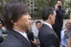 FILE - Ippei Mizuhara, left, the former longtime interpreter for the Los Angeles Dodgers baseball star Shohei Ohtani, and his defense attorney, Michael Freedman, right, leave federal court following his arraignment, Tuesday, May 14, 2024, in Los Angeles. Mizuhara is scheduled to plead guilty Tuesday, June 4, 2024, to bank and tax fraud in a sports betting case where he is expected to admit to stealing nearly $17 million from the Japanese baseball player. (AP Photo/Damian Dovarganes, File)