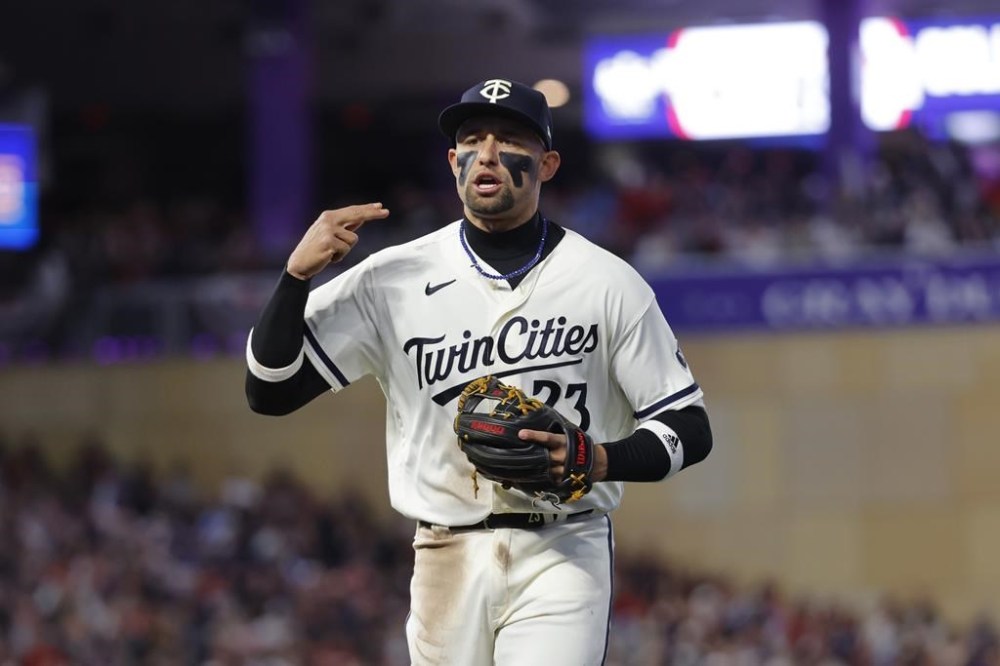 FILE - Minnesota Twins third baseman Royce Lewis runs off the field after throwing out Houston Astros' Jeremy Pena at first during the seventh inning of Game 4 of a baseball AL Division Series, Wednesday, Oct. 11, 2023, in Minneapolis. The Minnesota Twins reinstated third baseman Royce Lewis from the injured list on Tuesday, June 4, 2024, after a 58-game absence caused by a severely strained right quadriceps muscle. (AP Photo/Bruce Kluckhohn)
