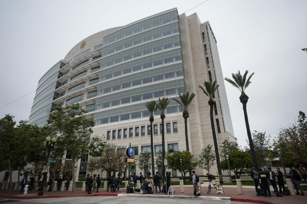 Members of the media wait for the arrival of Ippei Mizuhara, the former interpreter for the Los Angeles Dodgers baseball star Shohei Ohtani, outside federal court in Los Angeles, Tuesday, June 4, 2024. Mizuhara is scheduled to plead guilty Tuesday to bank and tax fraud in a sports betting case where he is expected to admit to stealing nearly $17 million from the Japanese baseball player. (AP Photo/Damian Dovarganes)