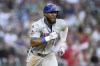 New York Mets' Starling Marte runs toward first base on his two-run triple against the Washington Nationals, during the fifth inning of a baseball game Tuesday, June 4, 2024, in Washington. (AP Photo/Nick Wass)