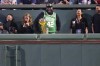 Boston Red Sox great David Ortiz smiles while standing with the NBA Larry O'Brien Championship Trophy while watching the Red Sox's baseball game against the Atlanta Braves, Tuesday, June 4, 2024, at Fenway Park in Boston. The Boston Celtics host the Dallas Mavericks in Game 1 of the NBA Finals on Thursday. (AP Photo/Charles Krupa)