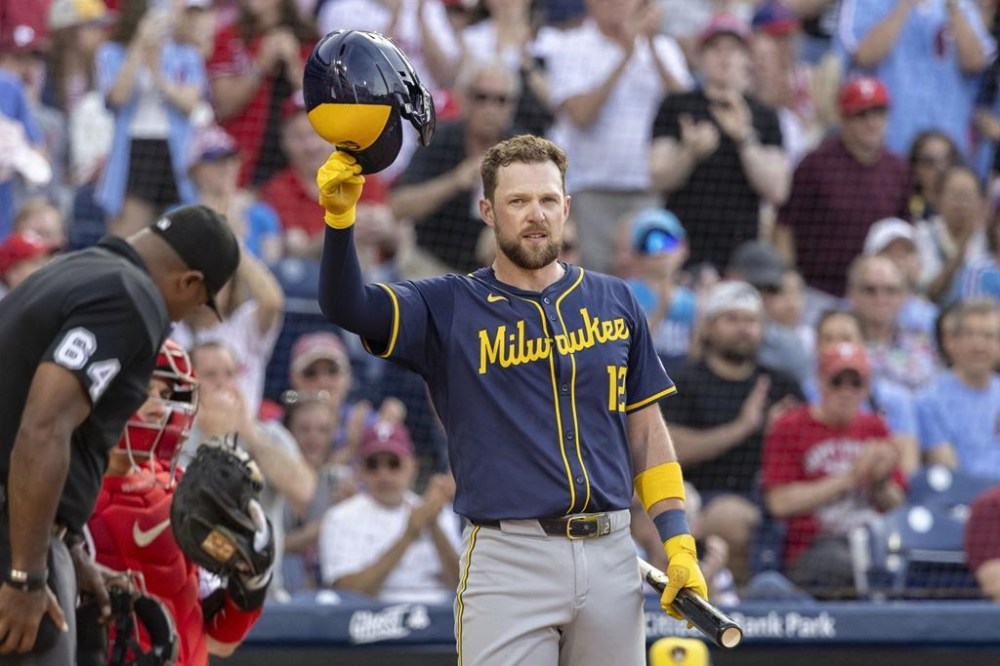 Milwaukee Brewers and former Philadelphia Phillies player Rhys Hoskins tips his hat to fans during the second inning of a baseball game Tuesday, June 4, 2024, in Philadelphia. (AP Photo/Laurence Kesterson)