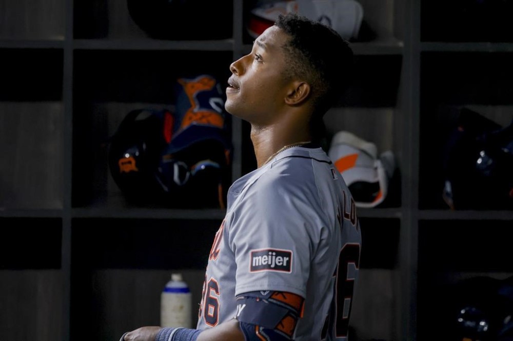Detroit Tigers' Justyn-Henry Malloy stands in the dugout after striking out during the fourth inning of the team's baseball game against the Texas Rangers, Tuesday, June 4, 2024, in Arlington, Texas. (AP Photo/Gareth Patterson)