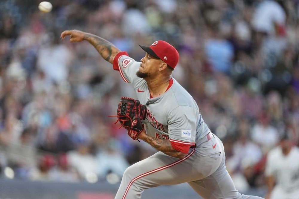 Cincinnati Reds starting pitcher Frankie Montas works against the Colorado Rockies in the fifth inning of a baseball game Tuesday, June 4, 2024, in Denver. (AP Photo/David Zalubowski)